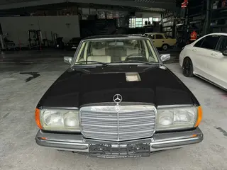 Oldtimer wertgutachten mercedes w123 schwarz frontansicht